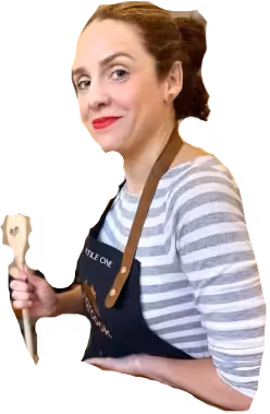 Köchin mit Holzlöffel